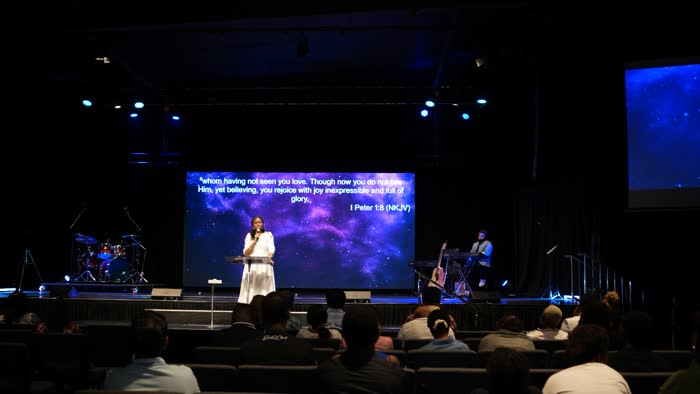 Dr. Imaobong Odutola ministering at a conference