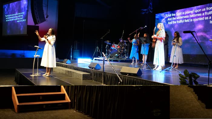 Dr. Imaobong Odutola ministering at a conference