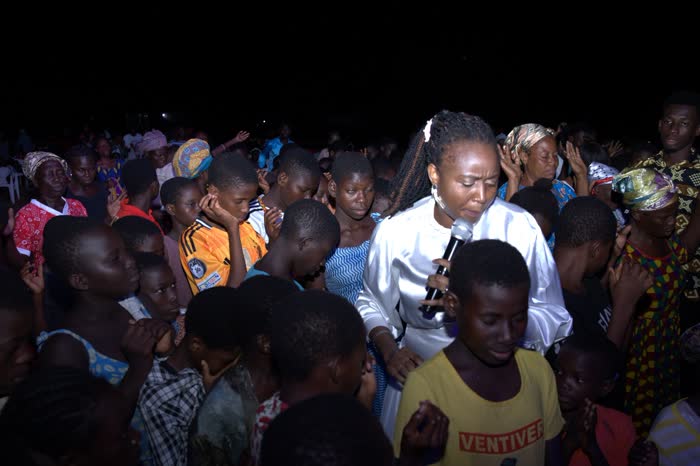 Believers gathered at a crusade meeting